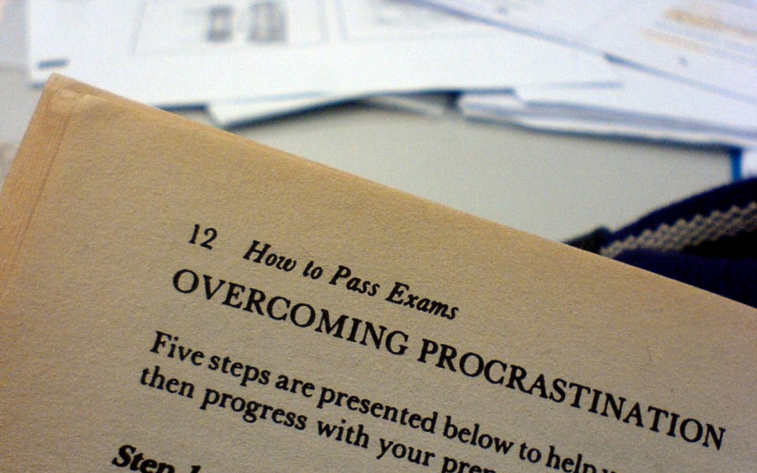 A book, it reads "How to pass exams", Overcoming Procrastination