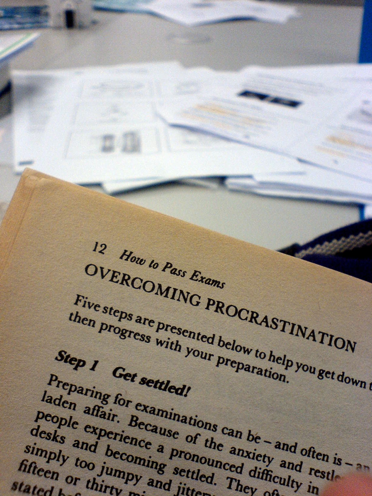 A book, it reads "How to pass exams", Overcoming Procrastination