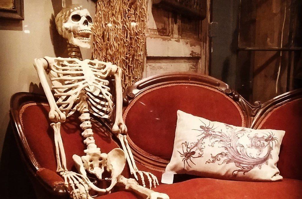 A skeleton sitting on a couch
